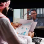 Arab-man-interviewing-a-African-guy-through-video-conference